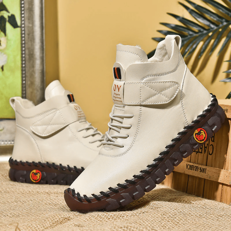 Winter high-top orthopedic boots for women in white leather with black lug sole.