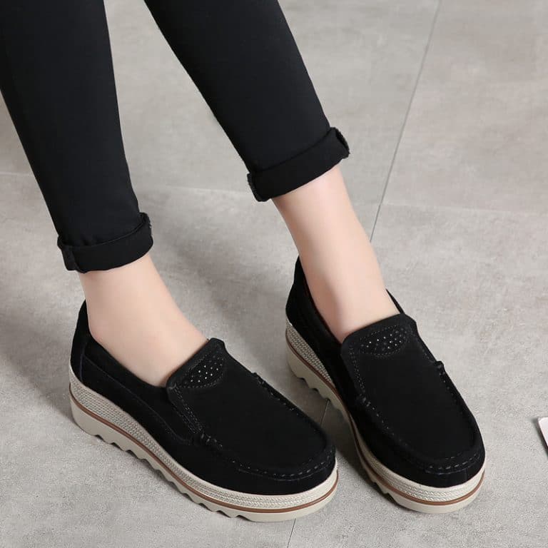 Women's comfort shoe, black suede loafer with platform and slip-on design.