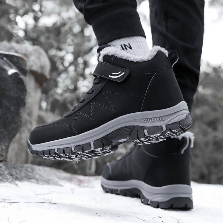 Winter orthopedic shoe showing the profile with a plush interior and a notched outsole.