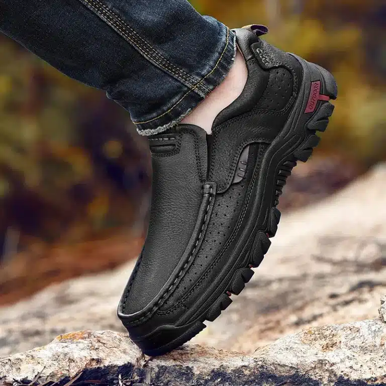 Close-up view of men's black leather orthopedic shoes.