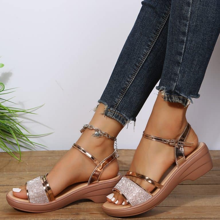 Platform shoes for women with curved sole and double shiny strap.