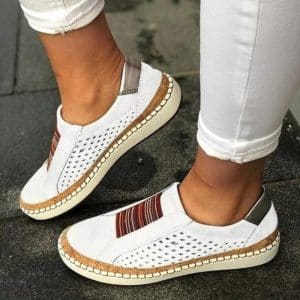 White casual shoes for women with elastic bands.