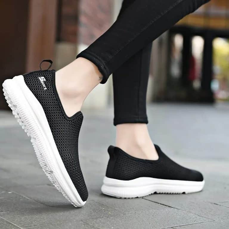 Casual black women's shoes with dense mesh and contrasting white outsole.
