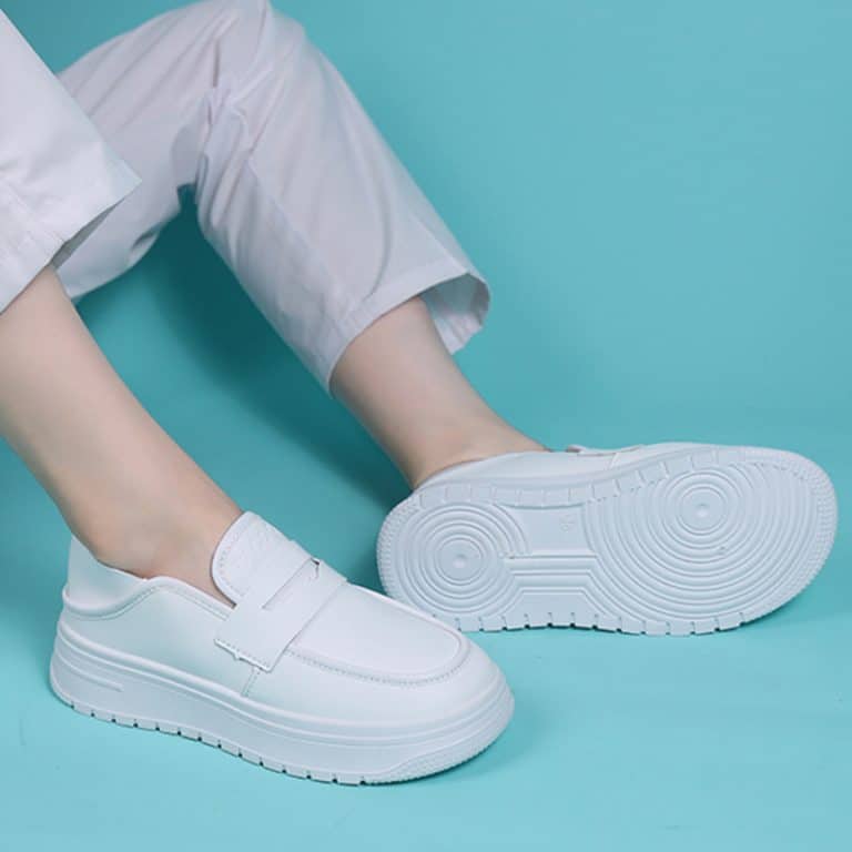 White orthopedic shoes for women with high arches with thick soles and Velcro closure