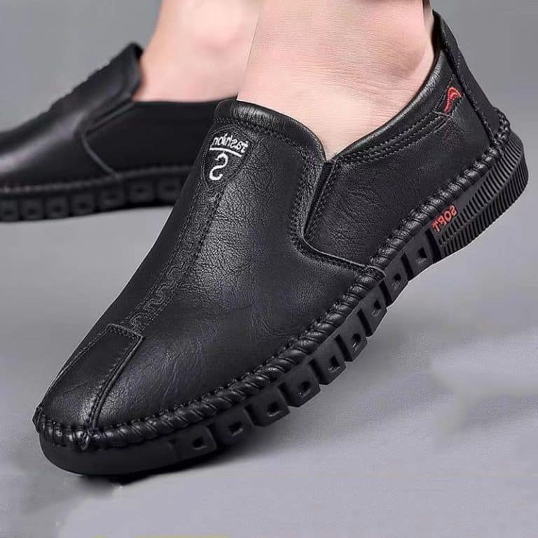 Black orthopedic shoes for men with non-slip sole and decorative stitching on the top.