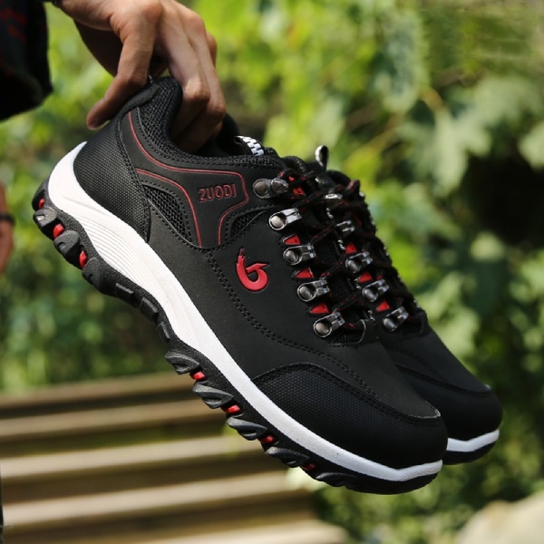 Black orthopedic shoes for wide feet men, with a red logo and unique laces.