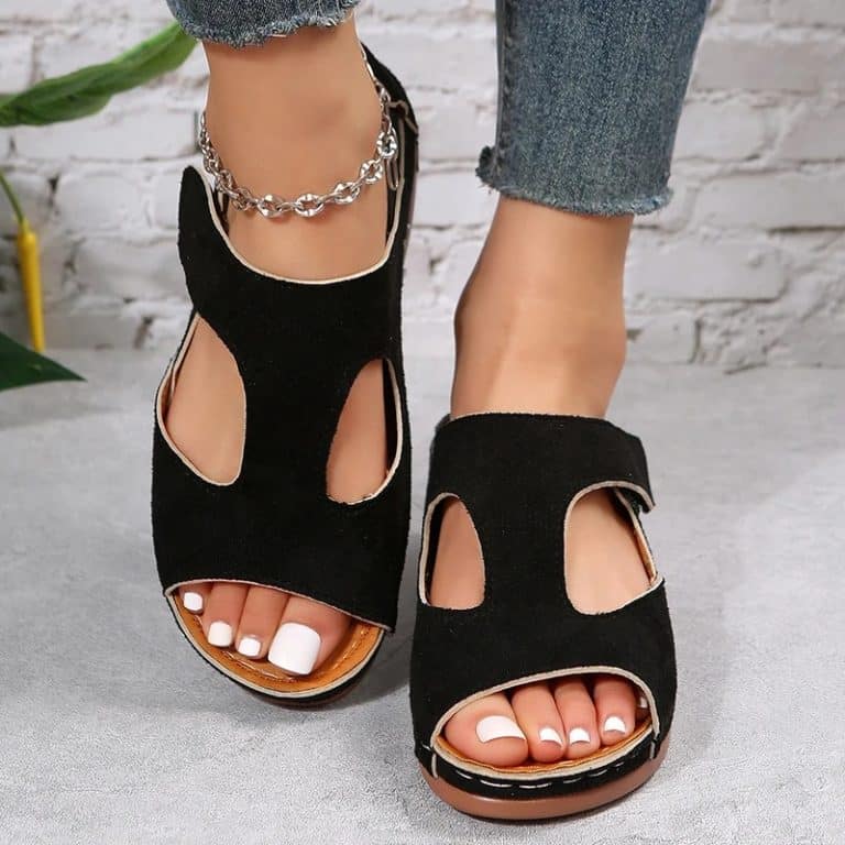 Orthopedic shoes for women in black mesh with black ergonomic sole.