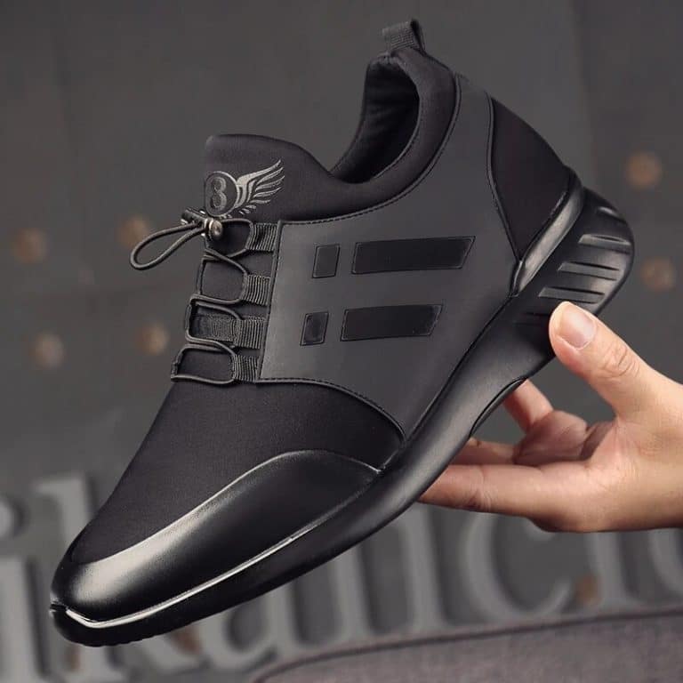 Orthopedic shoes for men in sport style in black with an elastic band and a winged logo.
