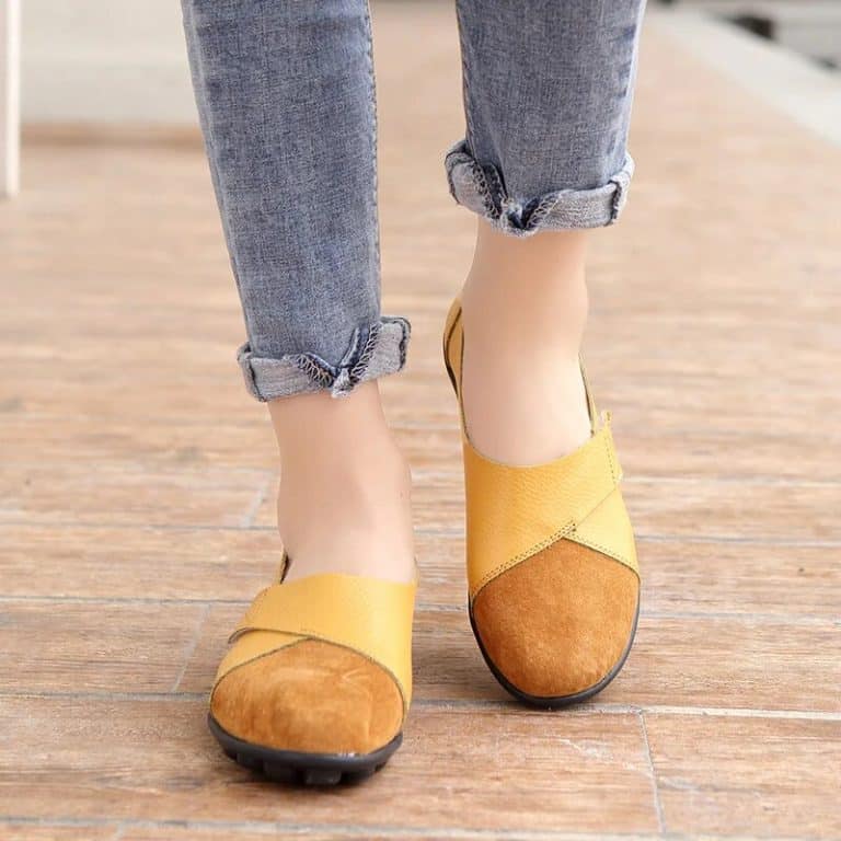 Yellow and brown leather moccasins for women with flexible sole and cross strap.