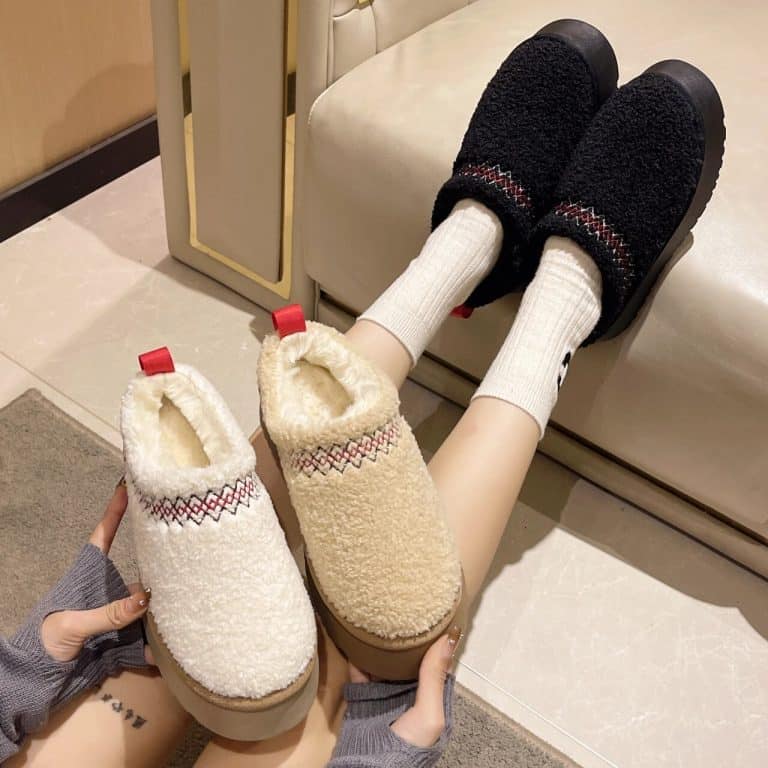 Pairs of orthopedic slippers for women in sheepskin wool, in cream, black, and beige.
