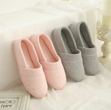 Comfortable slippers in pink and gray, presented side by side.