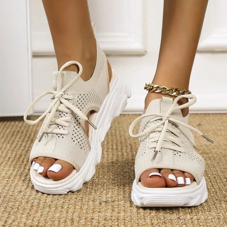 Beige women's sandals, breathable with thick white sole and matching laces.