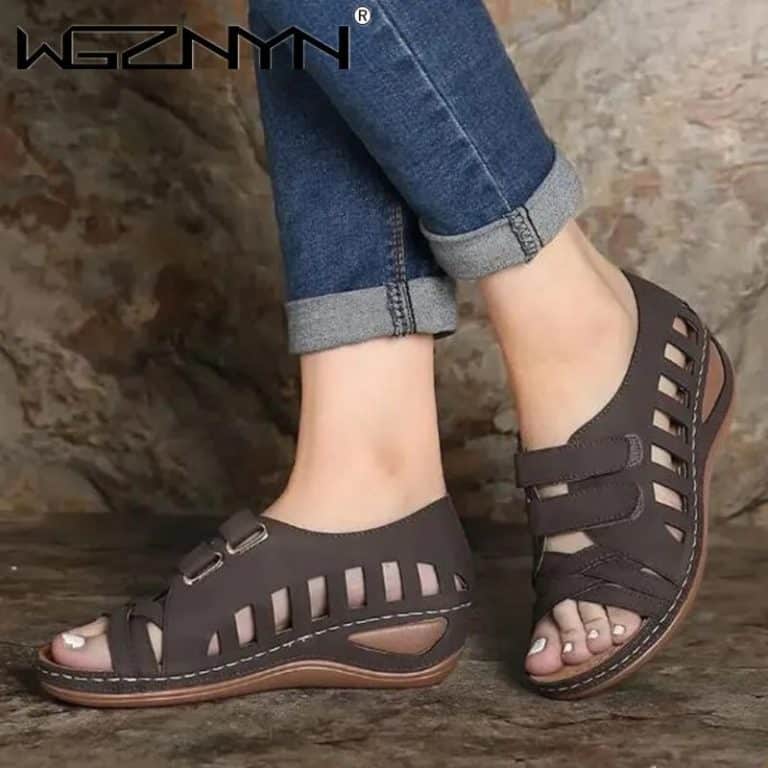 Women's black summer comfort sandals with cut-out details and padded insole.