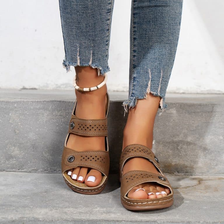 Orthopedic leather sandals for women, with open back and patterned perforations.