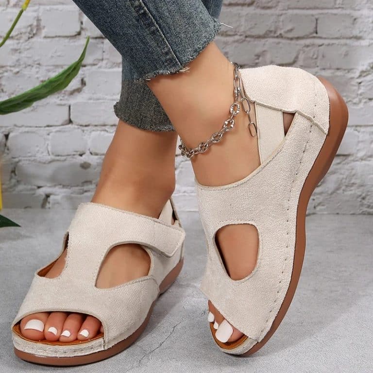 Orthopedic brown mesh sandals for women with a ventilated design.