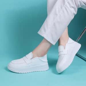 Front view of women's white platform loafers, highlighting the thick sole.