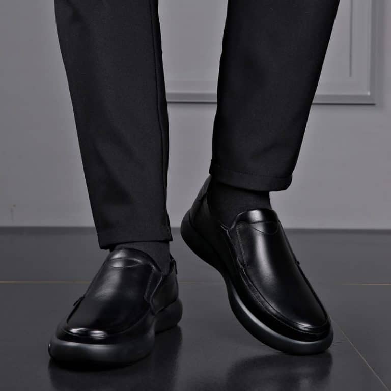 Front view of a men's black orthopedic office shoe, demonstrating the elegant design.