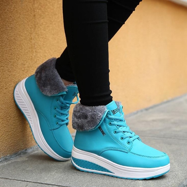 Light blue hiking boots with grey fur trim.