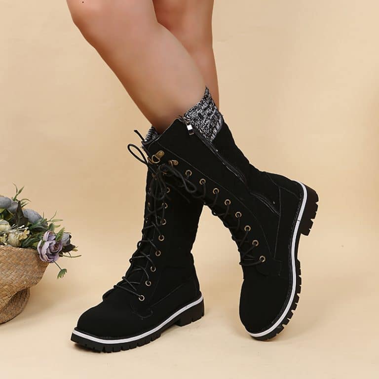 Black women's boots with gray and white knit on the upper part.