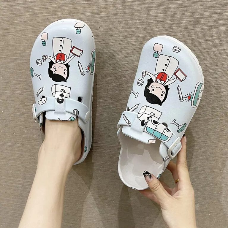 Medical-themed slippers worn, with light blue patterns and white buckles.