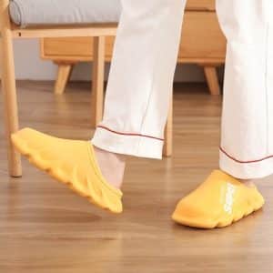 Comfort orthopedic slippers for women in bright yellow with a wavy sole.