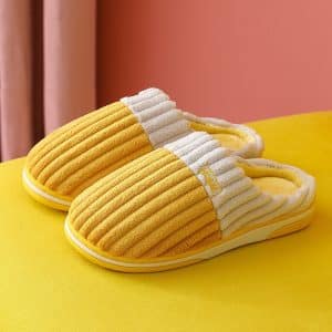 Comfortable mustard yellow and white cotton slippers with yellow sole and terry cloth interior.
