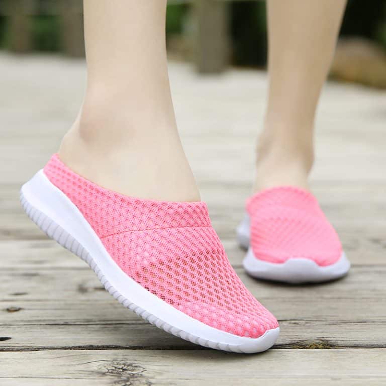 Open orthopedic slippers for women, pink color, with a white sole and breathable mesh upper.
