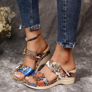 Wedge shoes with animal print and synthetic leather straps.