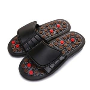 Massaging orthopedic slides for men with black strap and brown and red massage buttons.