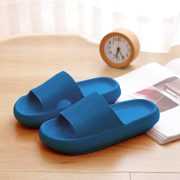 Comfortable orthopedic slides for women, bright blue color, with a minimalist design and thick sole.