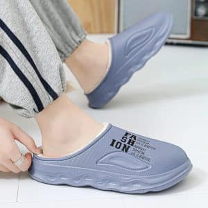 Blue slippers worn with fur lining and black print.