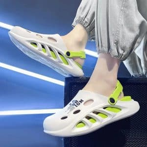 White orthopedic sandals with ventilation and neon green strap for summer comfort.