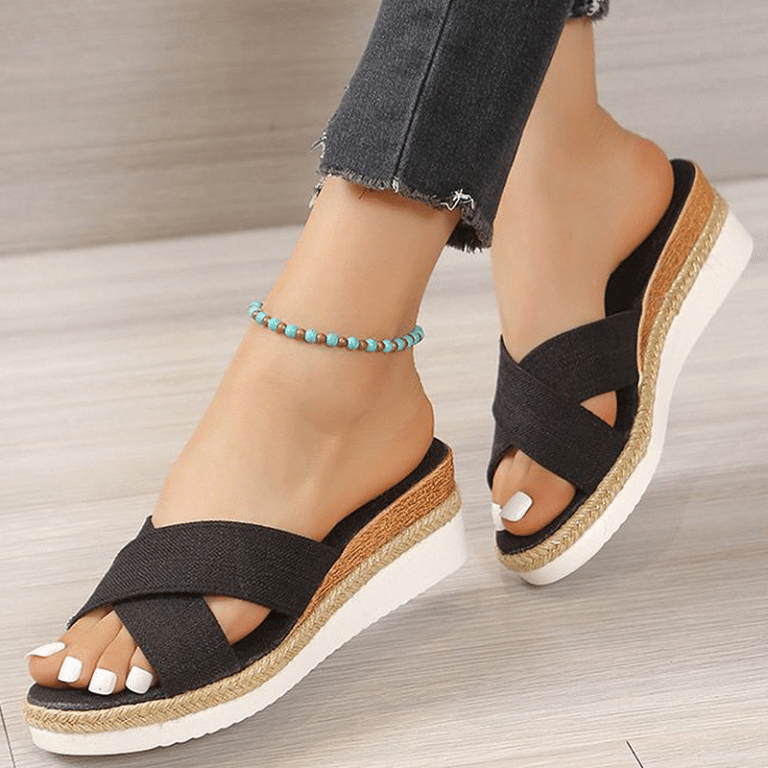 Black canvas wedge sandals with turquoise beaded ankle strap.