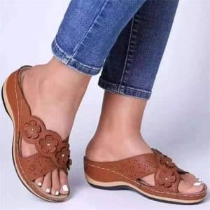 Brown orthopedic sandals for women with embossed floral patterns and comfortable insole.