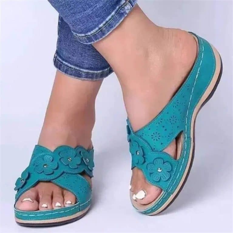 Orthopedic sandals for women in turquoise blue with embossed flowers and thick sole.