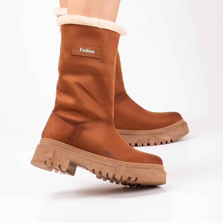 Rear view of high leather boots, sheepskin fur cuffs.