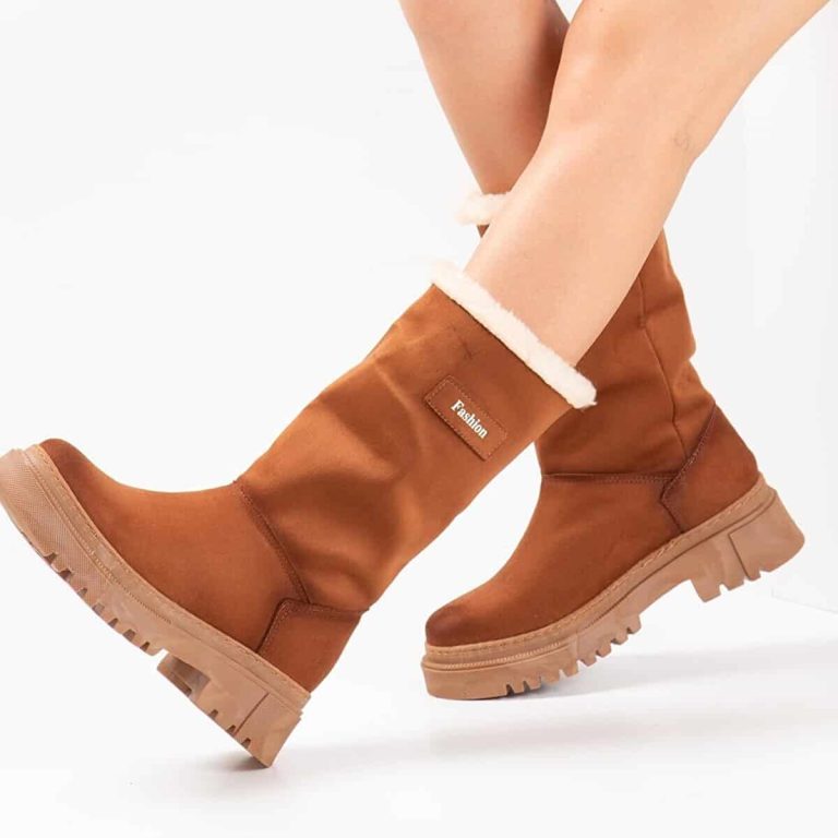 Oblique view of women's high boots, leather exterior.